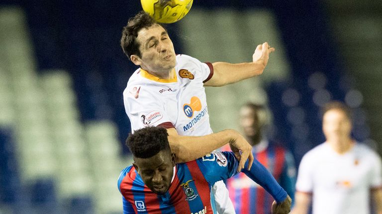 Carl McHugh with a header against Lonsana Doumbouya of Inverness CT on his return to action