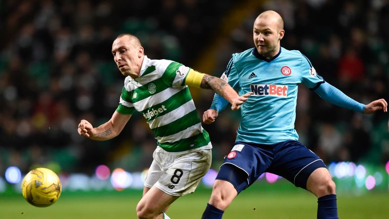 Scott Brown and Grant Gillespie compete for the ball
