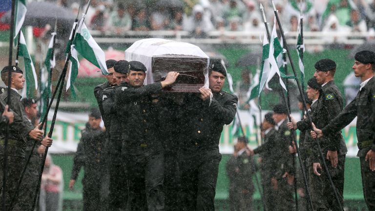 CHAPECO, BRAZIL - DECEMBER 03:  Air Force troops carry coffin of one of the victims of the plane crash in Colombia at the Arena Conda stadium on December 0