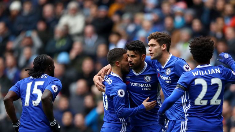 MANCHESTER, ENGLAND - DECEMBER 03:  Diego Costa (C) of Chelsea celebrates scoring his team's first goal with his team mates during the Premier League match