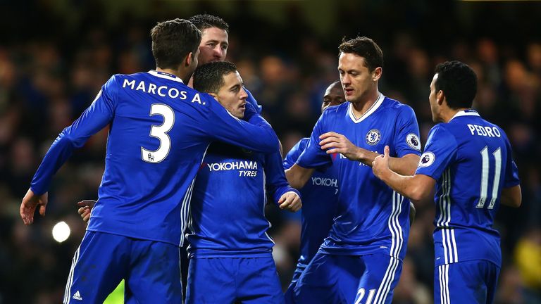 Eden Hazard, surrounded by his Chelsea team-mates, celebrates after extending Chelsea's lead at Stamford Bridge
