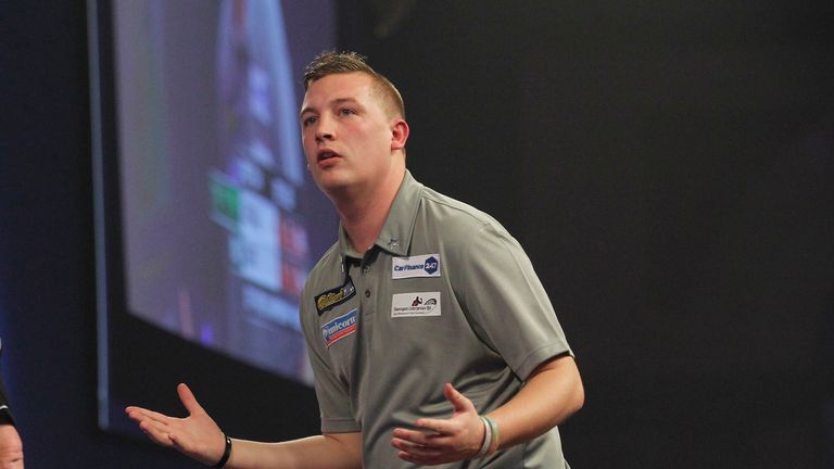 Chris Dobey's World Championship is over after a brave defeat to Dave Chisnall