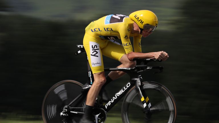 TOPSHOT - Great Britain's Christopher Froome, wearing the overall leader's yellow jersey, rides during the 17 km individual time-trial, the eighteenth stag