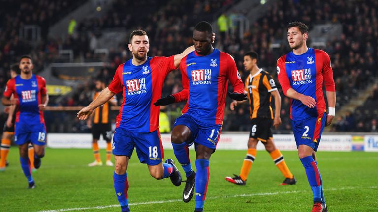 HULL, ENGLAND - DECEMBER 10:  Christian Benteke of Crystal Palace 917) celebrates with team mate as he scores their first and equalising goal from a penalt