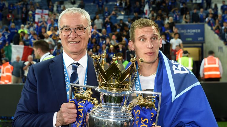LEICESTER, ENGLAND - MAY 07: Manager Claudio Ranieri (L) and Marc Albrighton (R) of Leicester City the Premier League Trophy as players and staffs celebrat
