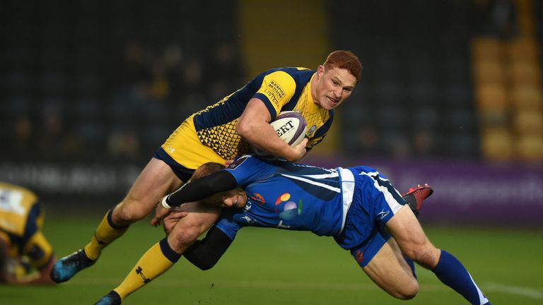 WORCESTER, ENGLAND - DECEMBER 10:  Connor Braid of Worcester Warriors is tackled by Sarel Pretorius of Newport Gwent Dragons during the European Rugby Chal