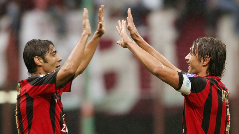 MILAN, Italy:  AC Milan's captain Paolo Maldini is congratulated by his teammate Manuel Rui Costa (L) during their Italian serie A football match at San Si