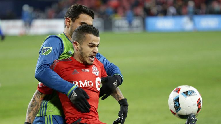 Seattle Sounders midfielder Cristian Roldan (7) battles with Toronto FC forward Sebastian Giovinco (10) during Seattle's MLS Cup final victory over Toronto