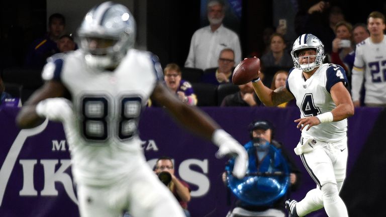 MINNEAPOLIS, MN - DECEMBER 1: Dak Prescott #4 of the Dallas Cowboys rolls out to pass as Dez Bryant #88 runs downfield in the second quarter of the game ag