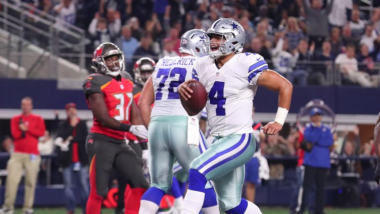 ARLINGTON, TX - DECEMBER 18:  Dak Prescott #4 of the Dallas Cowboys celebrates after scoring a touchdown during the second quarter against the Tampa Bay Bu