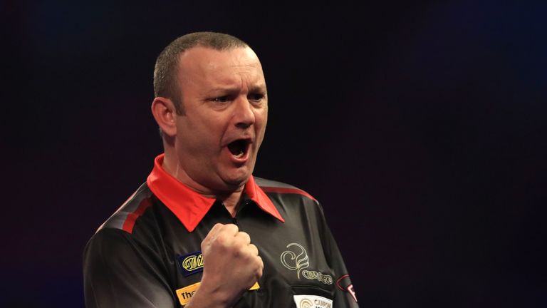 Darren Webster celebrates taking the opening set