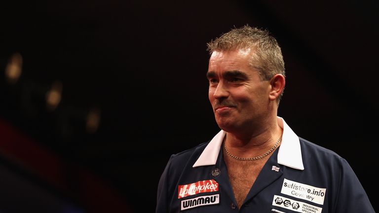 Steve Beaton of Great Britain reacts to winning his first round match against Magnus Caris of Sweden
