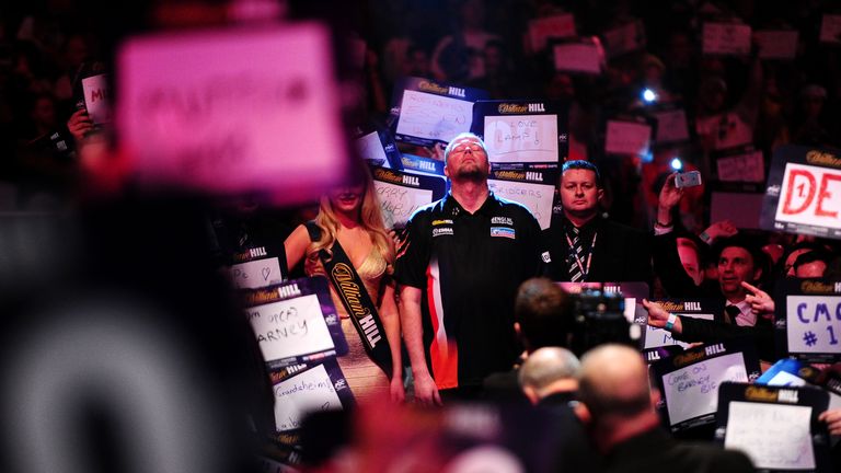 Raymond van Barneveld of the Netherlands prepares to take to the stage for his quarter final match against Michael Smith 