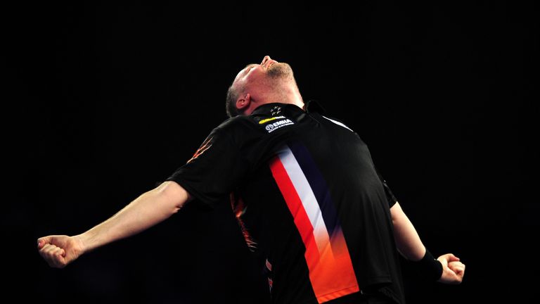 Raymond van Barneveld of the Netherlands celebrates victory over Michael Smith of England