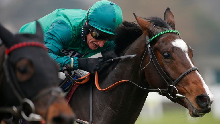 Daryl Jacob gets Messire Des Obeaux up to win the Neptune Investment Mangement Novices' Hurdle at Sandown.