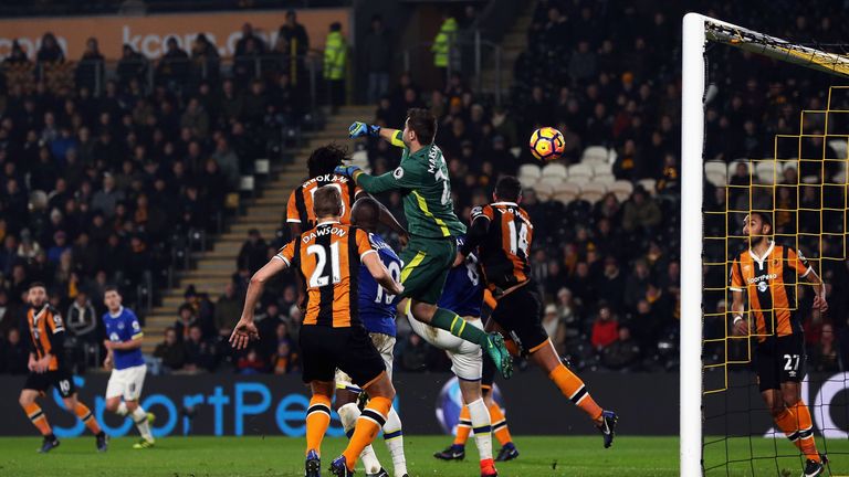 HULL, ENGLAND - DECEMBER 30:  Michael Dawson of Hull City watches as goalkeeper David Marshall of Hull City scores an own goal during the Premier League ma