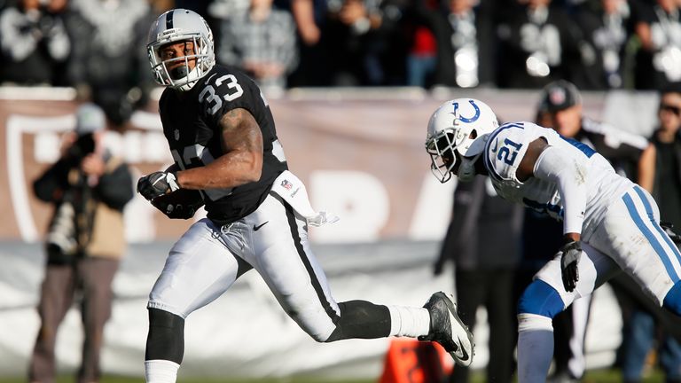 OAKLAND, CA - DECEMBER 24:  DeAndre Washington #33 of the Oakland Raiders rushes for a 22-yard touchdown against the Indianapolis Colts during their NFL ga