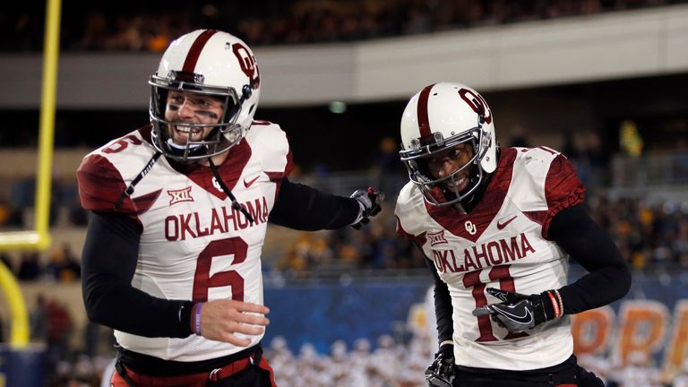 MORGANTOWN, WV - NOVEMBER 19:  Dede Westbrook #11 of the Oklahoma Sooners celebrates with Baker Mayfield #6 after scoring on a 75 yard touchdown pass again