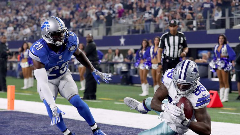 ARLINGTON, TX - DECEMBER 26:  Dez Bryant #88 of the Dallas Cowboys pulls in a touchdown pass against Johnson Bademosi #29 of the Detroit Lions in the secon