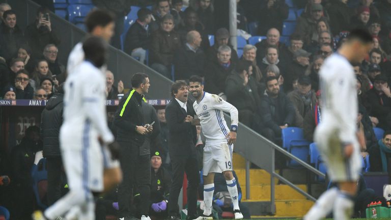 LONDON, ENGLAND - DECEMBER 17:  Diego Costa of Chelsea (R) celebrates scoring his sides first goal with Antonio Conte