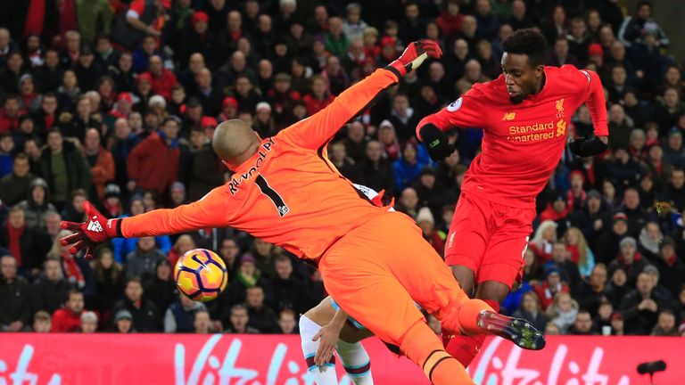 Liverpool's Belgian striker Divock Origi (R) scores their second goal to equalise during the English Premier League football match between Liverpool and We