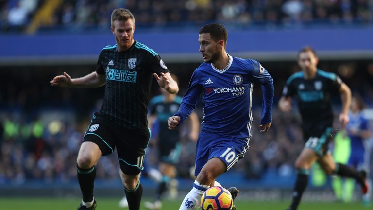 Chelsea's Eden Hazard takes on Chris Brunt 