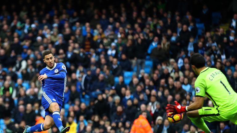 Eden Hazard of Chelsea scores his team's third goal during the Premier League match between Manchester City and Chelsea