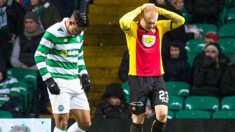 Partick defender Ziggy Gordon has his hands on his head after missing a chance against Celtic