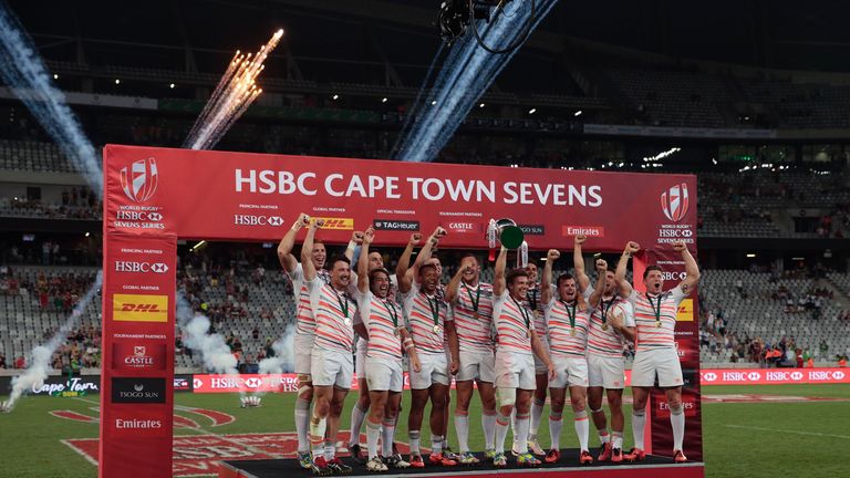 England's players celebrates on the podium after winning the  during the World Sevens Cape Town leg rugby match on December 11, 2016 at the Cape Town stadi