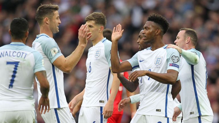 England's striker Daniel Sturridge (2nd R) celebrates with teammates after scoring the opening goal of the World Cup 2018 football qualification match betw