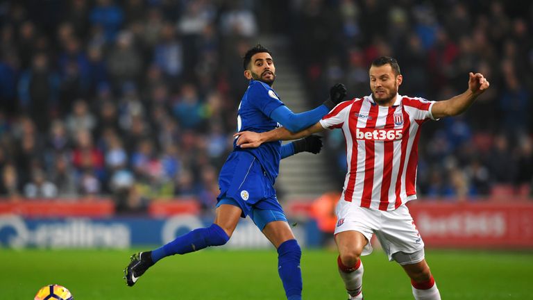 STOKE ON TRENT, ENGLAND - DECEMBER 17: Riyad Mahrez of Leicester City (L) and Erik Pieters of Stoke City (R) battle for possession during the Premier Leagu