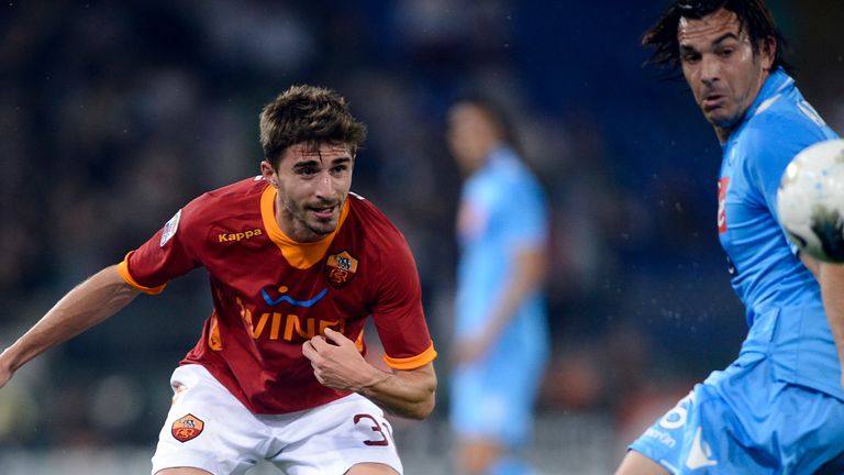 AS Roma's forward Fabio Borini (L) vies with Napoli's defender Salvatore Aronica during their Serie A football match in Rome's Olympic Stadium on April 28,