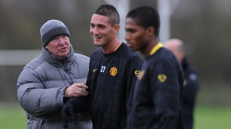 Sir Alex Ferguson shares a joke with Ferderico Macheda during training