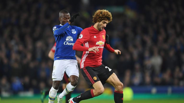 LIVERPOOL, ENGLAND - DECEMBER 04:  Marouane Fellaini of Manchester United holds off Enner Valencia of Everton during the Premier League match