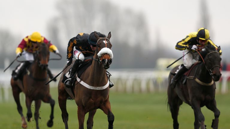 Gavin Sheehan riding Final Choice (C) on the way to winning the opening juvenile hurdle at Newbury