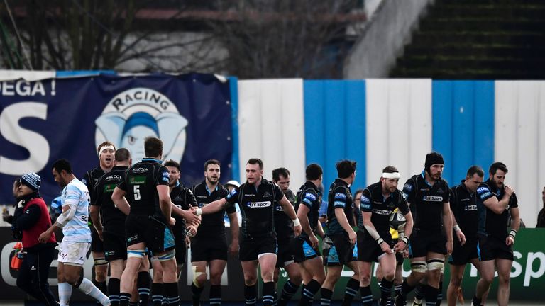 Glasgow Warriors players celebrate after scoring a try 