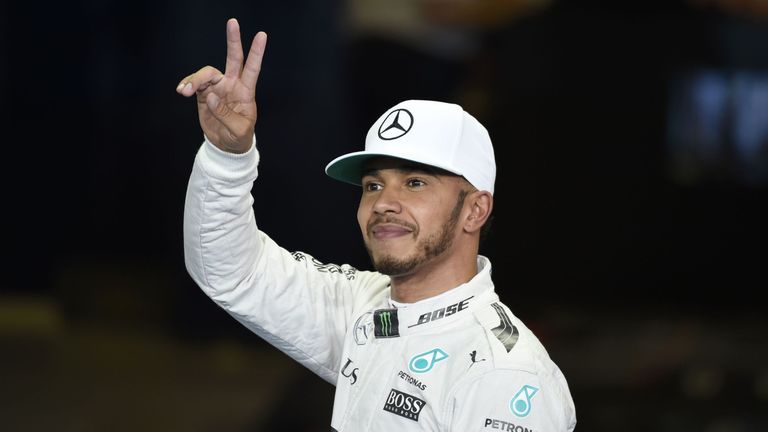 Lewis Hamilton gestures after taking pole position in the Abu Dhabi Grand Prx