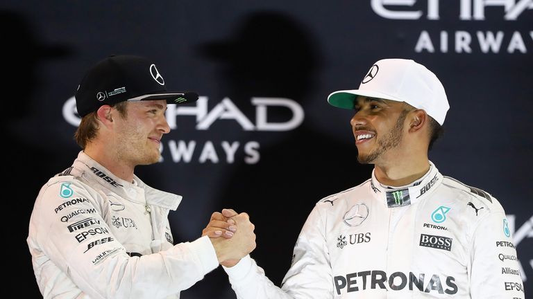 Race winner Lewis Hamilton congratulates World Champion Nico Rosberg