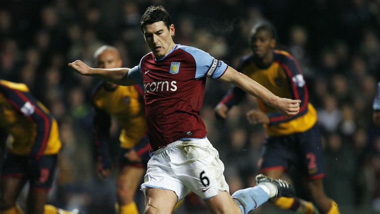 Aston Villa's English Midfielder Gareth Barry scores a penalty during their Premier League match against Arsenal at Villa Park, Birmingham, on December 26,