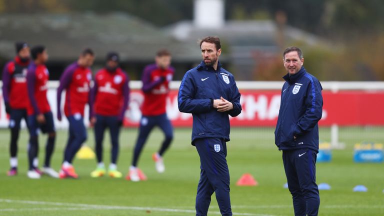 ENFIELD, ENGLAND - NOVEMBER 14:  Gareth Southgate interim manager of England and assistant Steve Holland look on during an England training session on the 