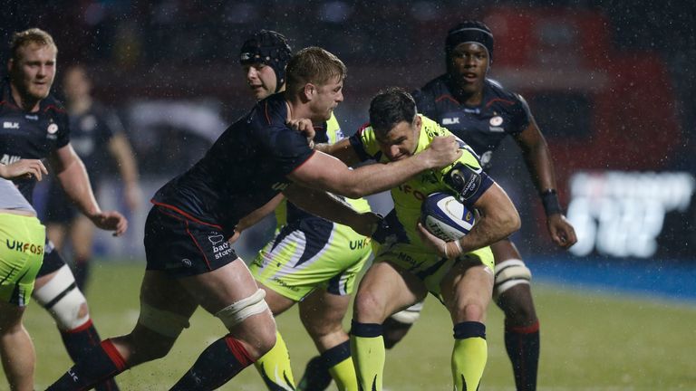 Saracens' George Kruis and Sale Sharks' Mike Phillips during the European Champions Cup, Pool Three match at Allianz Park, London.