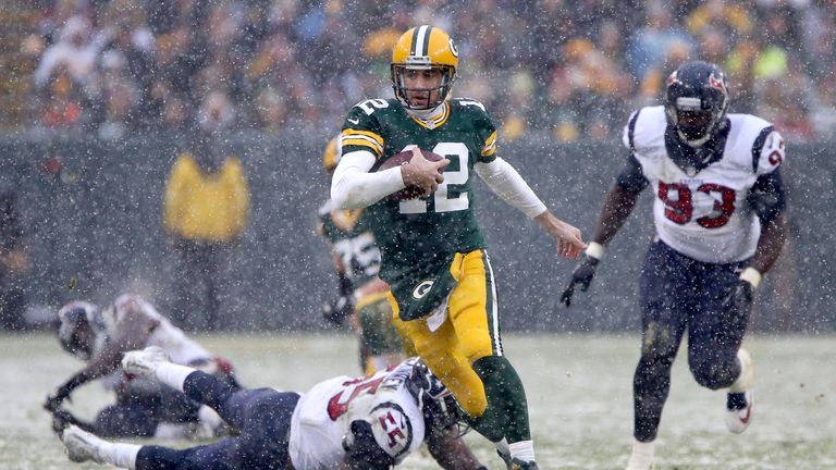 GREEN BAY, WI - DECEMBER 04:  Aaron Rodgers #12 of the Green Bay Packers runs with the ball in the fourth quarter against the Houston Texans at Lambeau Fie