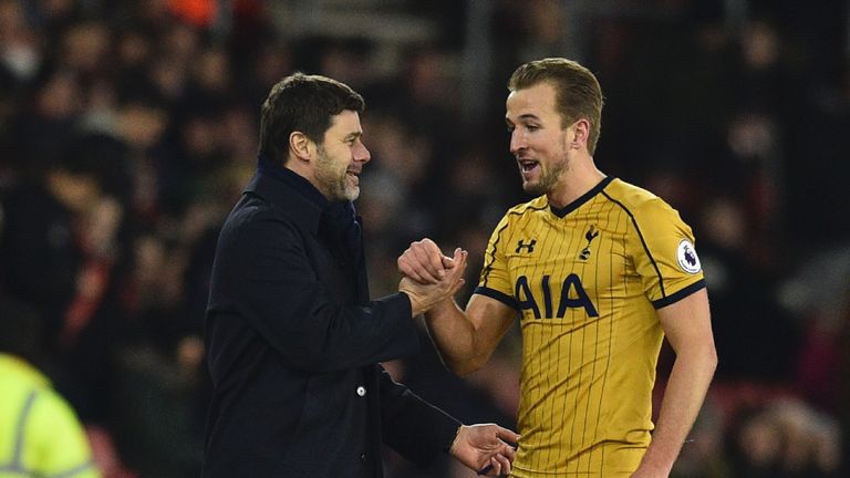 Mauricio Pochettinoembraces Tottenham Hotspur's  striker Harry Kane