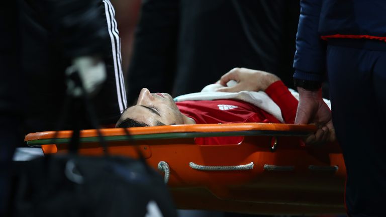 MANCHESTER, ENGLAND - DECEMBER 11:  Henrikh Mkhitaryan of Manchester United is taken off by a stretcher after the challenge by Danny Rose of Tottenham Hots