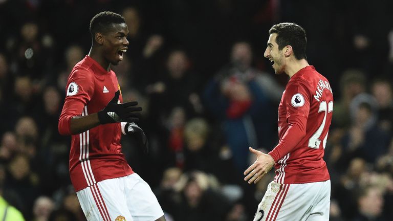 Henrikh Mkhitaryan celebrates with Paul Pogba after scoring Manchester United's third goal