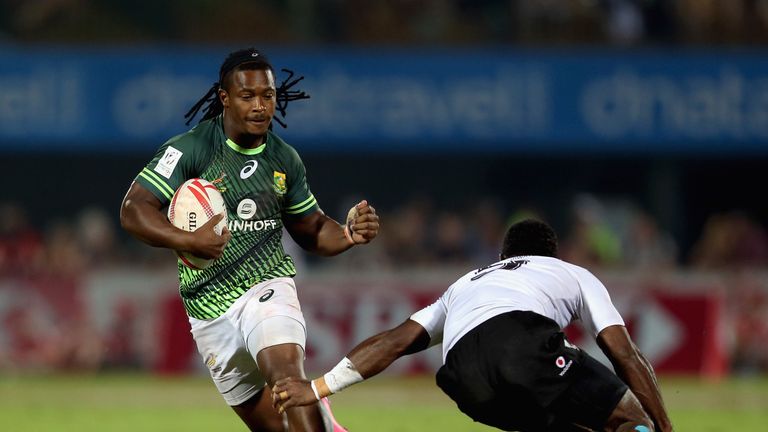 DUBAI, UNITED ARAB EMIRATES - DECEMBER 03:  Branco du Preez of South Africa in action against Fiji during the Emirates Dubai Rugby Sevens - HSBC World Seve