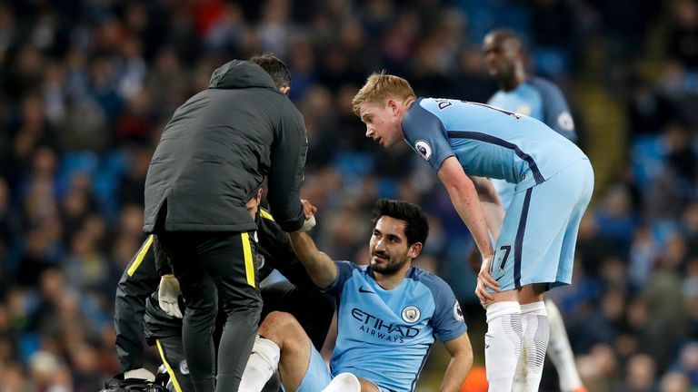 Ilkay Gundogan receives treatmentbefore leaving the pitch