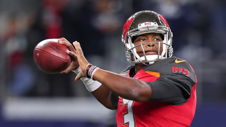 Jameis Winston warms up on the field prior to the game against the Dallas Cowboys