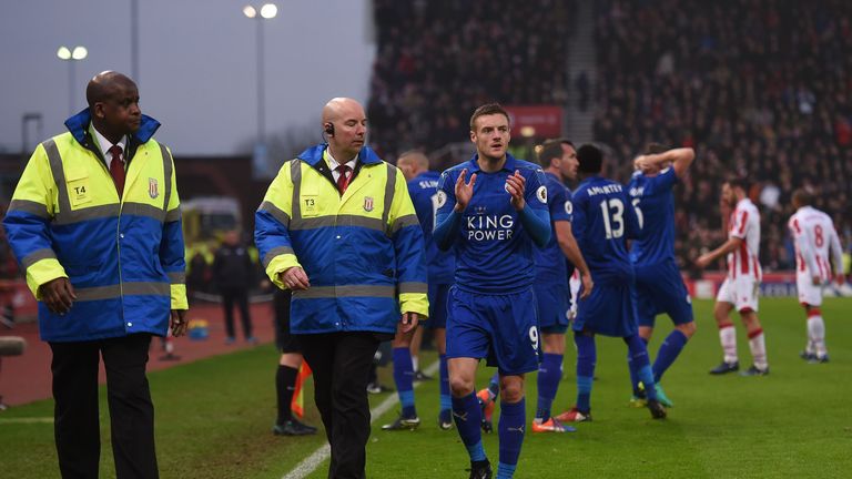 Leicester City's English striker Jamie Vardy (C) is escorted to the player's tunnel after receiving a red card for his challenge on Stoke City's Senegalese