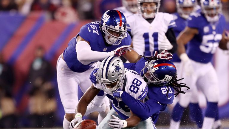 EAST RUTHERFORD, NJ - DECEMBER 11:  Dez Bryant #88 of the Dallas Cowboys fumbles the ball as  Janoris Jenkins #20 and  Keenan Robinson #57 of the New York 